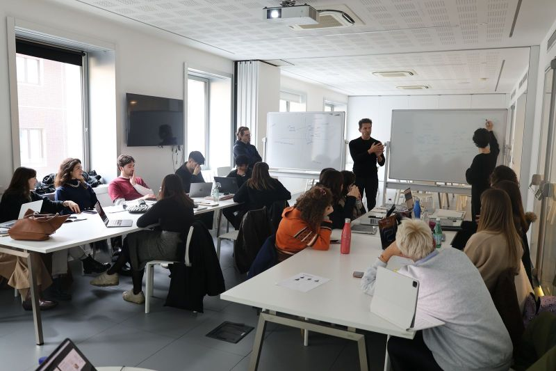 Gabriele Betti presenting to students at Raffles Milano